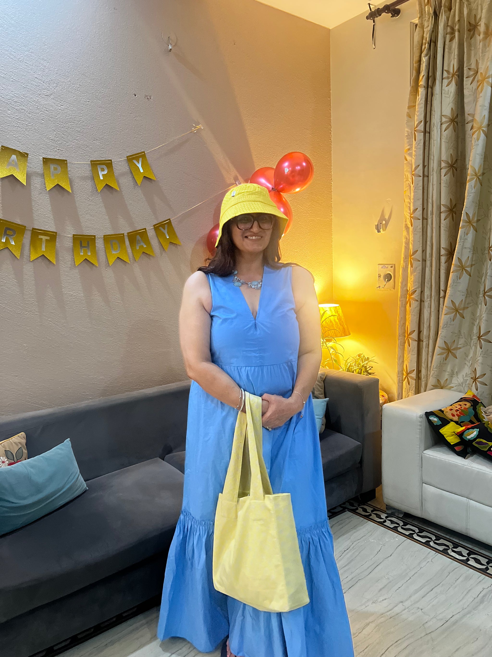 Rupa Saluja in Coastal Skies Dress and OTBL Bucket Hat